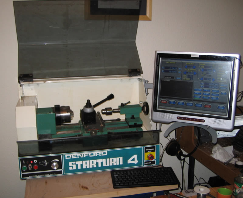 Overall view of the lathe - notice the extra switch and LEDs by the original on/off switches. The switch gives auto/manual spindle control and LEDs show the status.