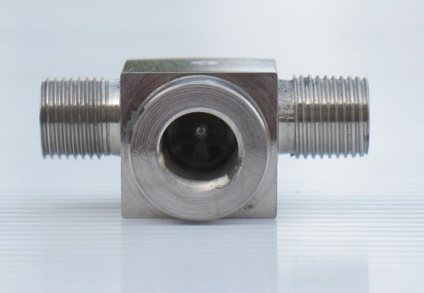 The through hole is intentionally offset to make it easier to bleed the brakes.