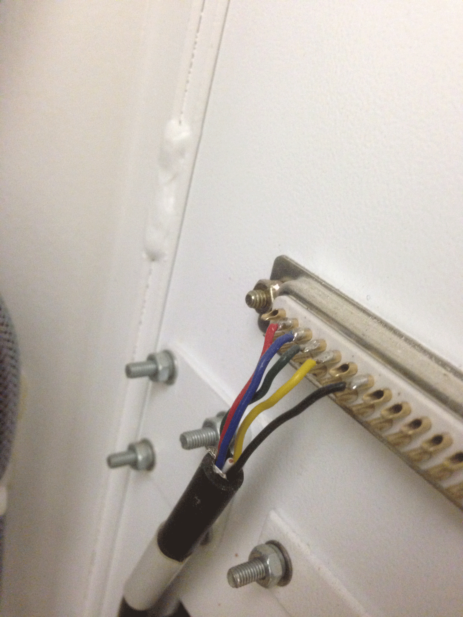 The 9 pin cable comes from the board and connects here