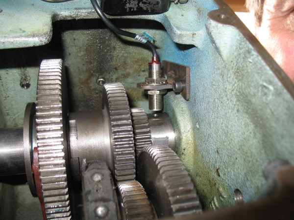 The sensor mounted inside the headstock.  It is bolted to holes drilled and threaded from outside the headstock.