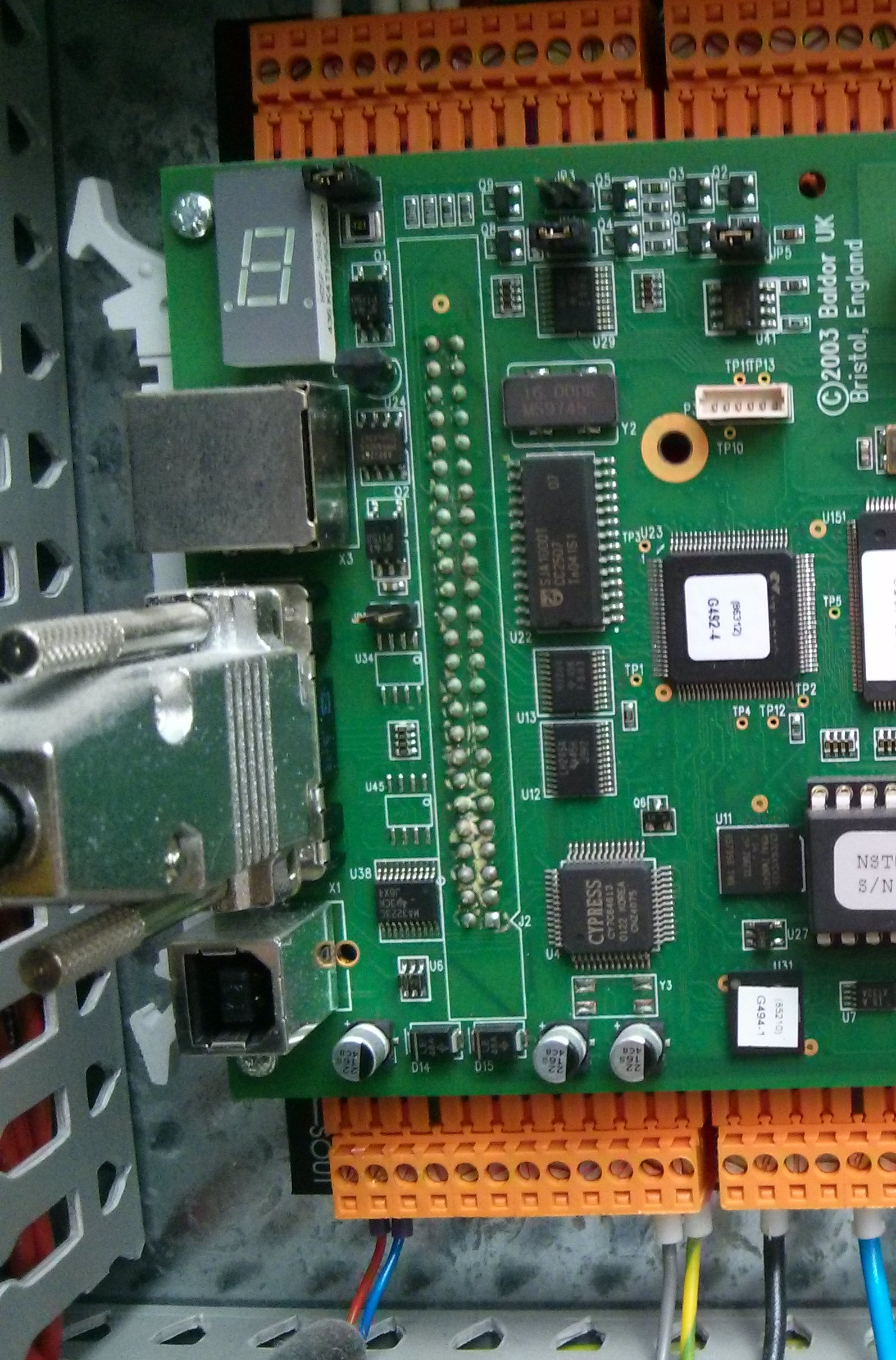 Top Board with 7 segment display, DB9 cable, and USB Type B connector to the bottom left