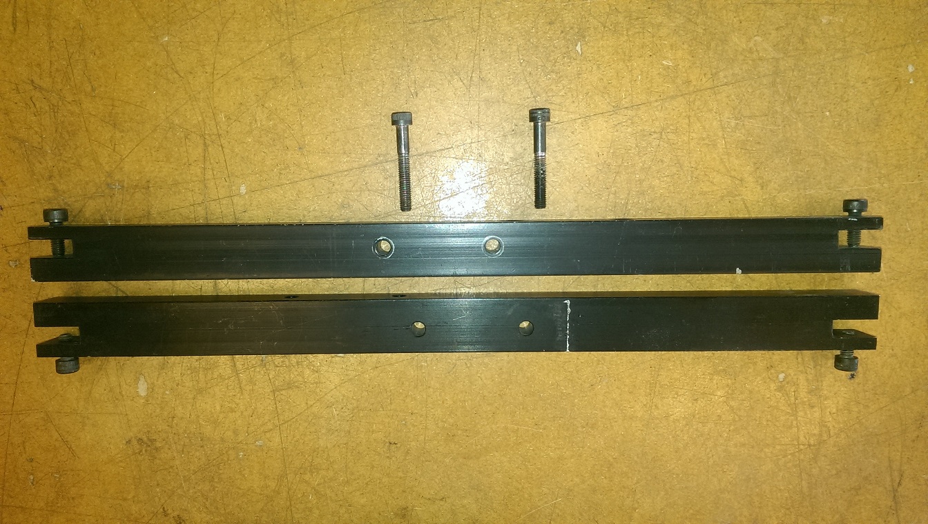 End rails showing offset to each other as one is flipped to indicate they are not centred
