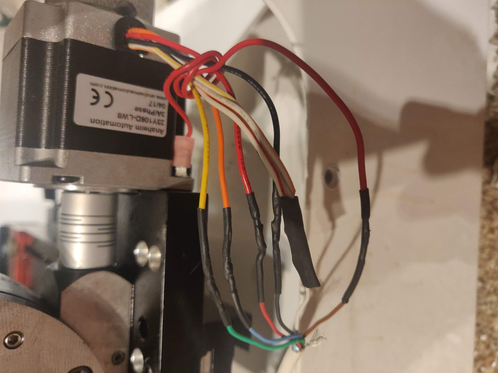 messy messy- note red-brown ground wire wrapped around then attached to stepper mount screw