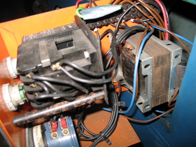 Shows the switch gear, relay and transformer before modification.
