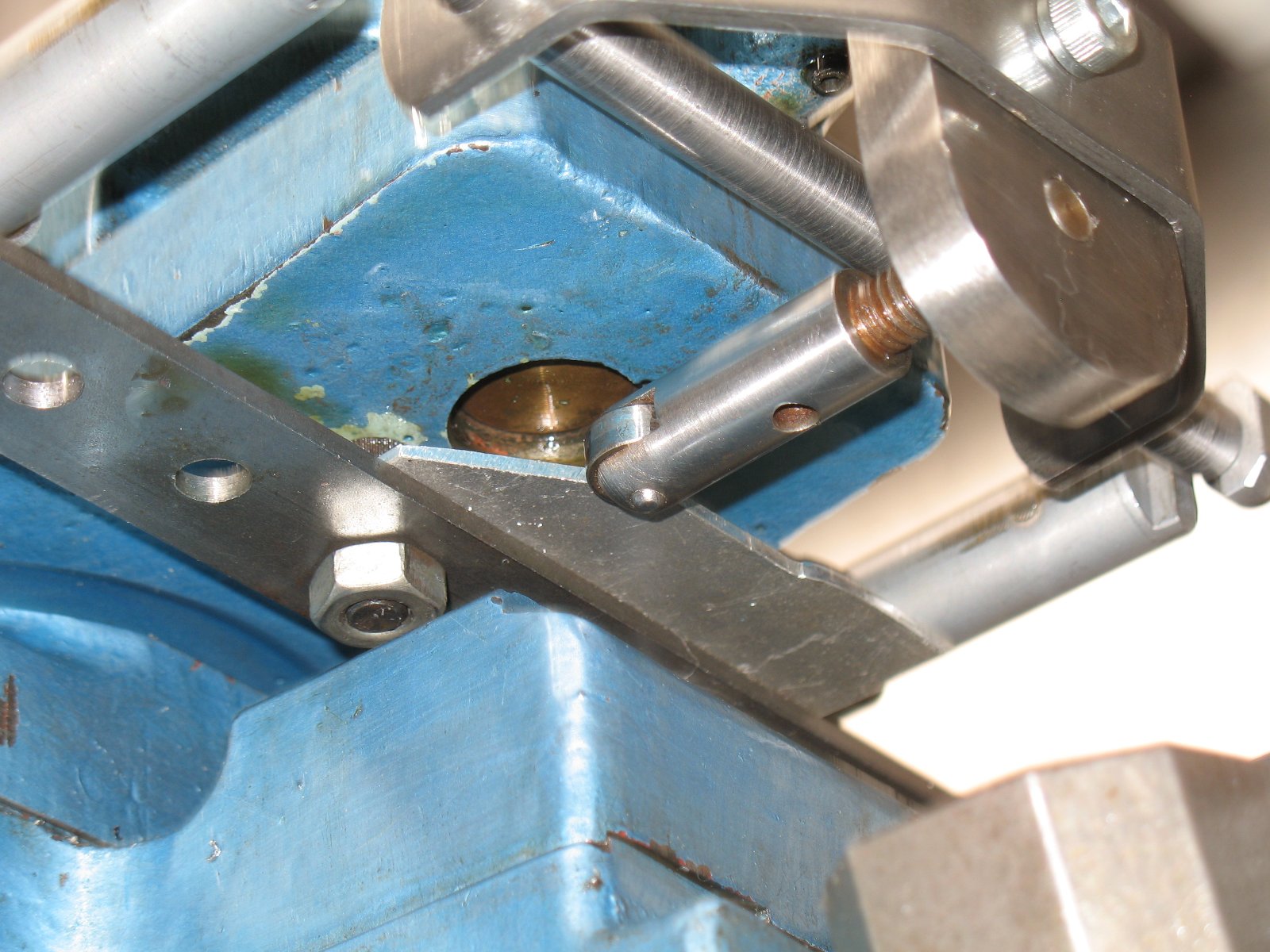A template is bolted to a drilled flat bar and the roller follower controls the tool path.