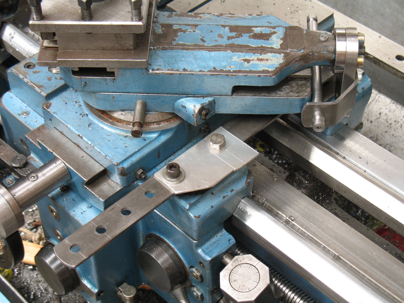 The top slide rotated away to show a template in place.