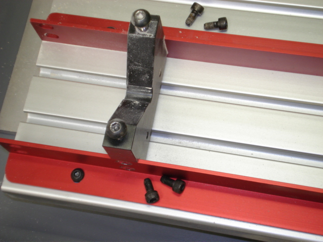 Remove the 4 bolts from the V-block.