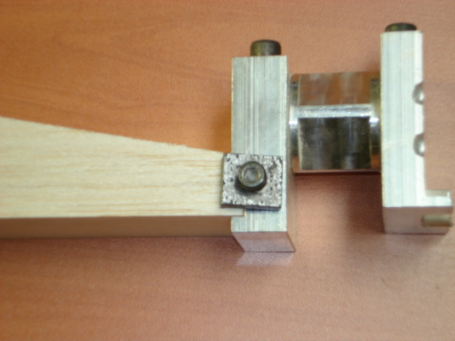 Tighten the clamps to hold the front of the block to the nose plate.